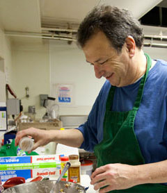 man working in a food pantry